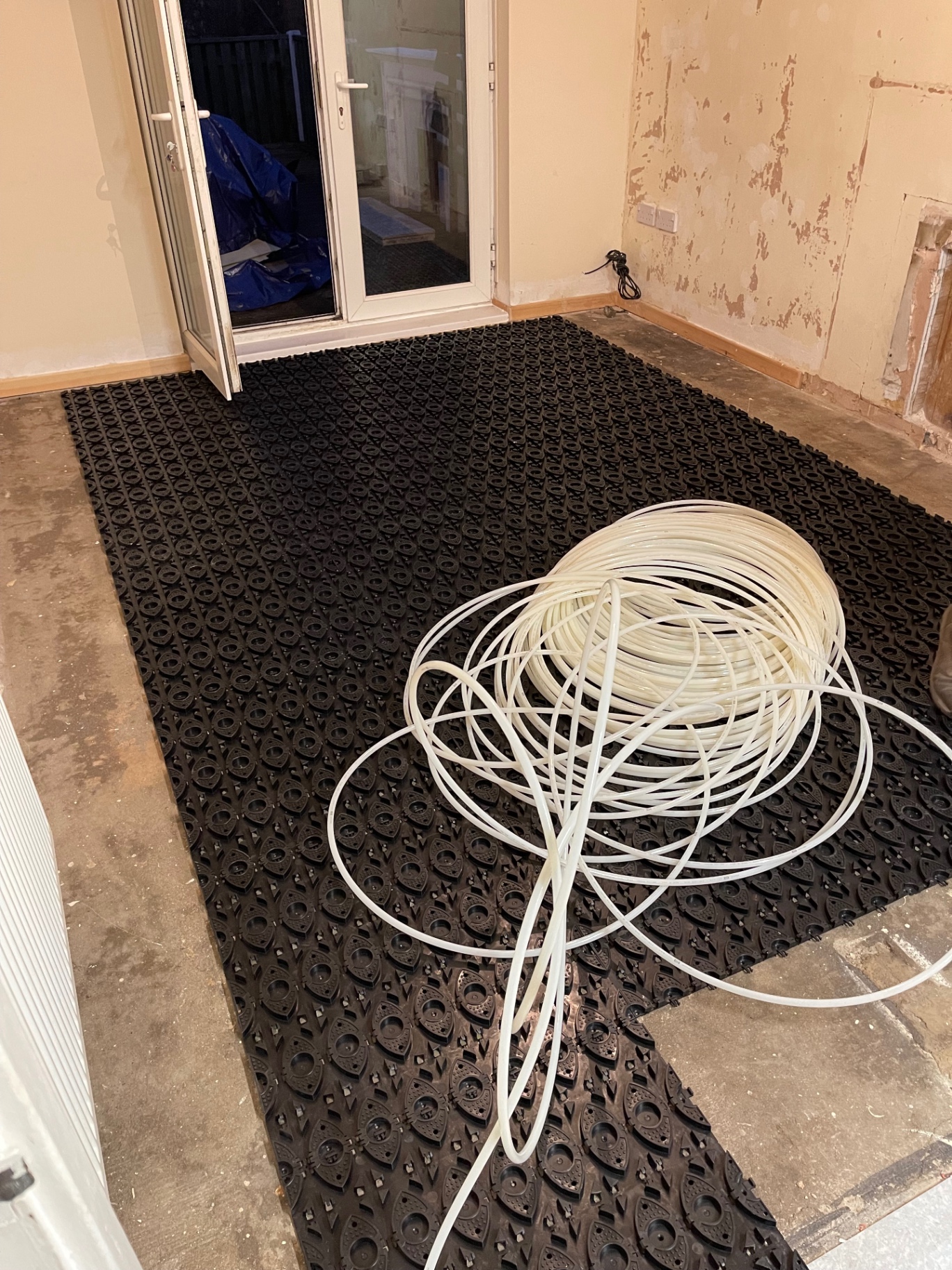 Underfloor heating pipework clipped into panels before screeding
