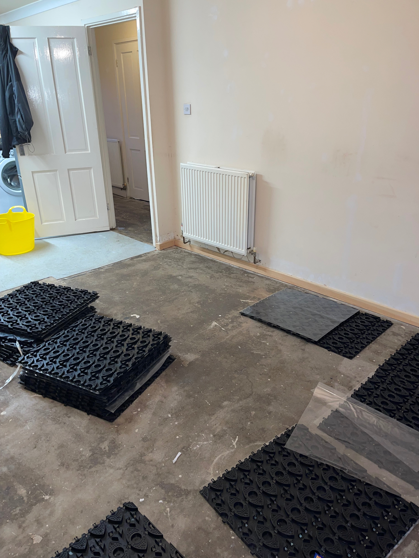 Castellated underfloor heating panels laid on a prepared concrete subfloor