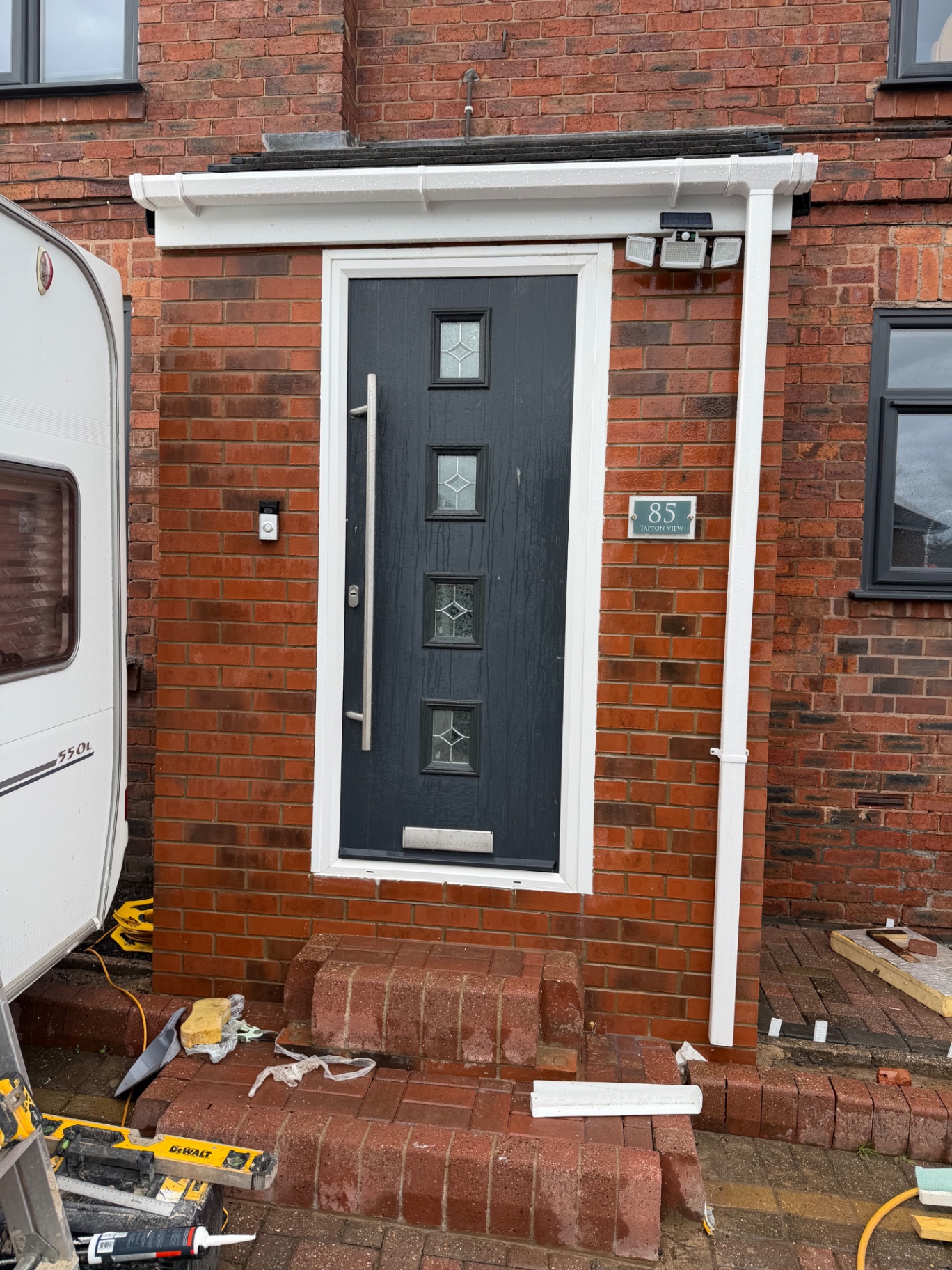 Completed brick porch extension in Sheffield with a composite front door